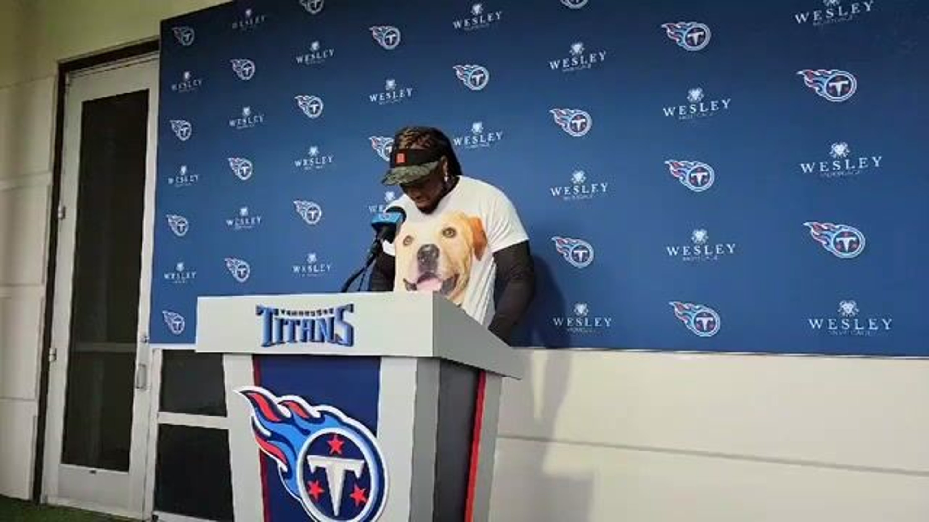 Derrick Henry is wearing a t shirt repping Bam Bam, a dog in the